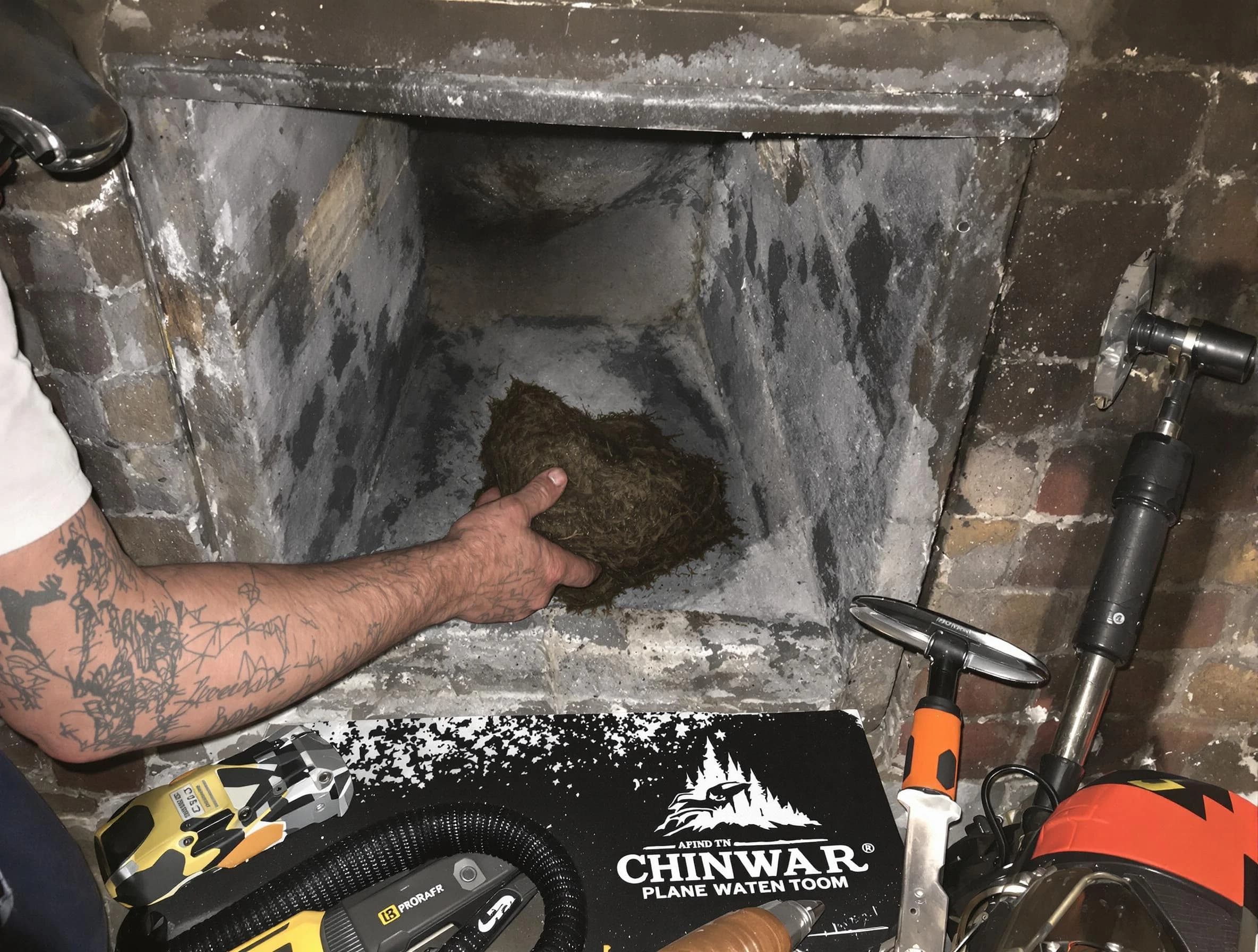 Redan Chimney Sweep safely removing debris and screening chimney in Redan, GA